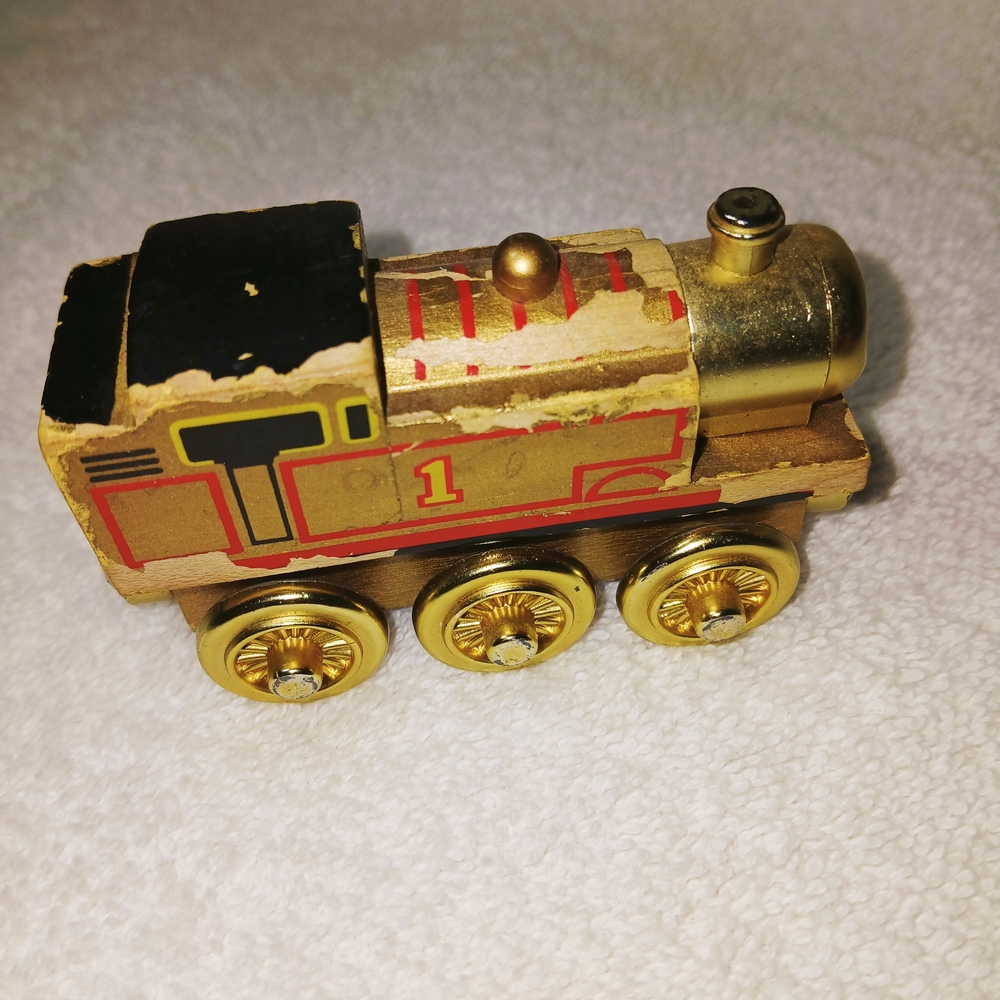 Wooden Toy Train with Gold and Red Accents
